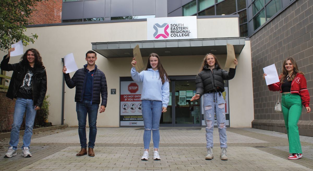 Image showing group of Further Education students outside our Lisburn campus holding their results